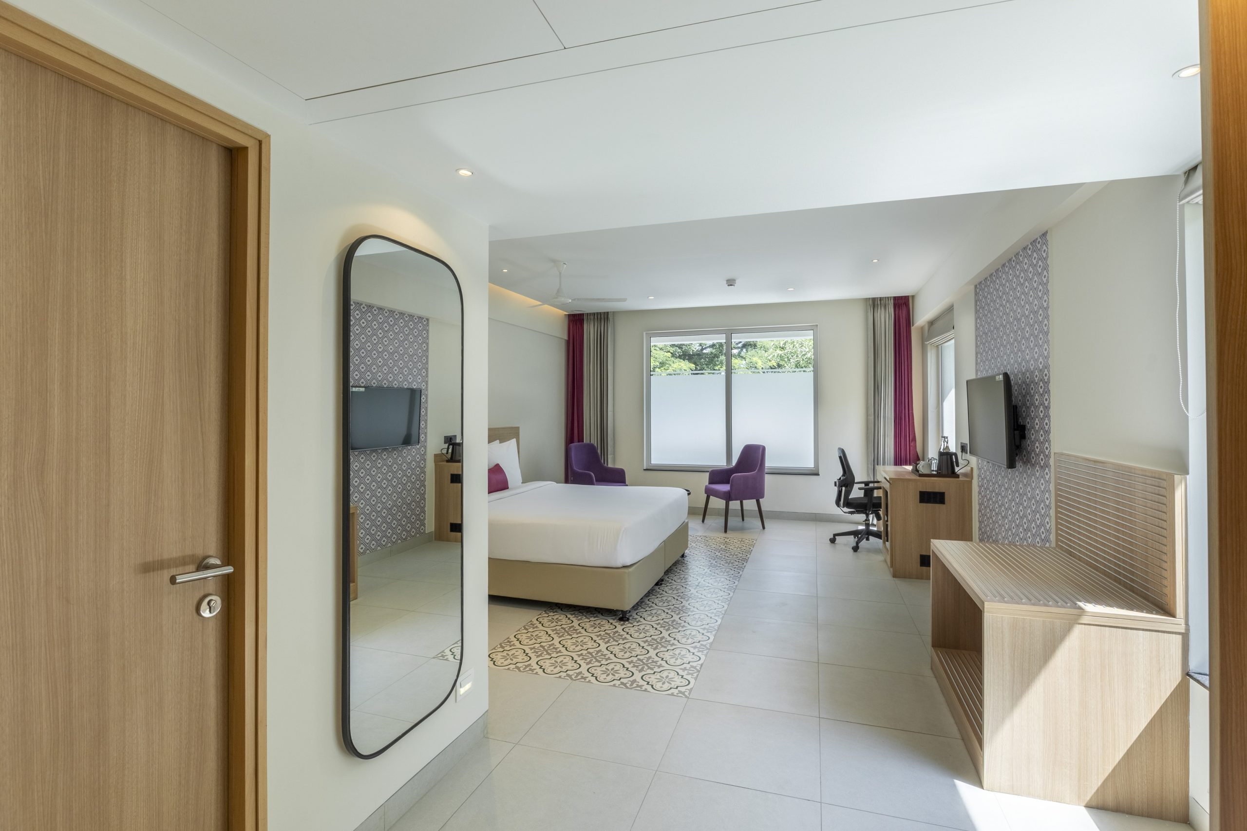 Suite bedroom opening to a living area