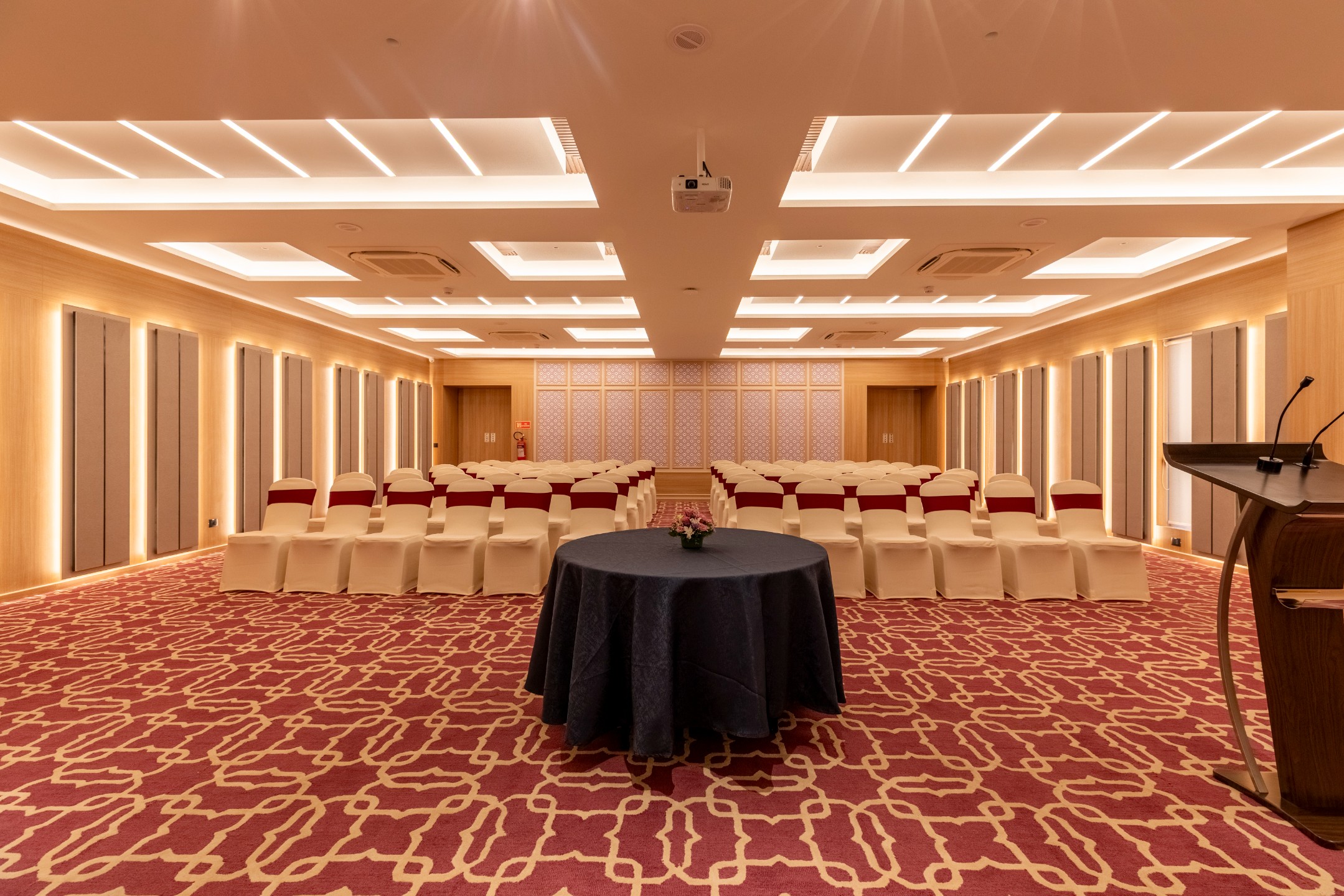 Kesar by Lilac dining room with warm wood and soft seating